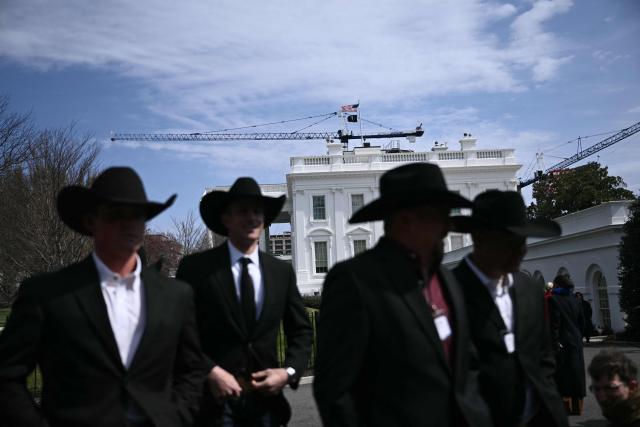 Members of the Wrangler National Finals Rodeo champions walk outside of the White House in Washington, DC on March 13, 2026 prior a meeting with US President Donald Trump in the Oval Office. (Photo by Brendan SMIALOWSKI / AFP)