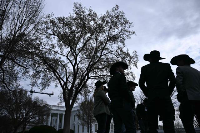 Members of the Wrangler National Finals Rodeo champions walk outside of the White House in Washington, DC on March 13, 2026 prior a meeting with US President Donald Trump in the Oval Office. (Photo by Brendan SMIALOWSKI / AFP)