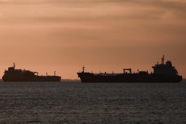 This photograph shows oil tankers anchored at the Grand Port Maritime de Marseille-Fos at sunset, in Fos-sur-Mer, off the Mediterranean coast of southern France on March 13, 2026. (Photo by Thibaud MORITZ / AFP)