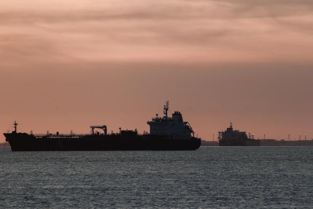 This photograph shows oil tankers anchored at the Grand Port Maritime de Marseille-Fos at sunset, in Fos-sur-Mer, off the Mediterranean coast of southern France on March 13, 2026. (Photo by Thibaud MORITZ / AFP)