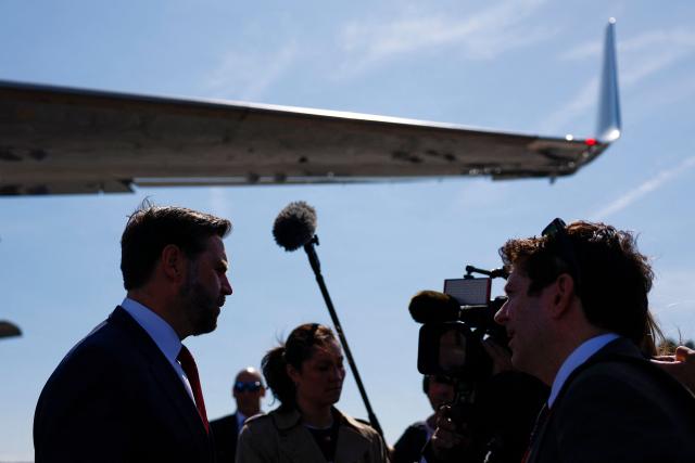US Vice President JD Vance (L) speaks to the media before boarding Air Force Two en route to Washington, DC at Rocky Mount-Wilson Regional Airport on March 13, 2026 in Elm City, North Carolina. Vance traveled to North Carolina to deliver remarks on the Trump administration's economic agenda. (Photo by Kent Nishimura / POOL / AFP)