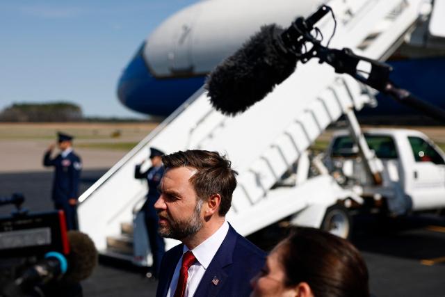 US Vice President JD Vance (C) speaks to the media before boarding Air Force Two en route to Washington, DC at Rocky Mount-Wilson Regional Airport on March 13, 2026 in Elm City, North Carolina. Vance traveled to North Carolina to deliver remarks on the Trump administration's economic agenda. (Photo by Kent Nishimura / POOL / AFP)