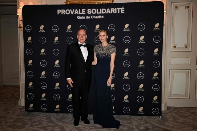 Princess Charlene of Monaco (R) and Prince Albert II of Monaco pose during a photocall as part of the Provale Solidarite charity gala at the Hotel Georges V in Paris on March 13, 2026. (Photo by Bertrand GUAY / AFP) / NO TABLOIDS WEB & PRINT, NO DAILY MAIL, NO DAILY MAIL GROUP, NO VOICI, NO CLOSER
