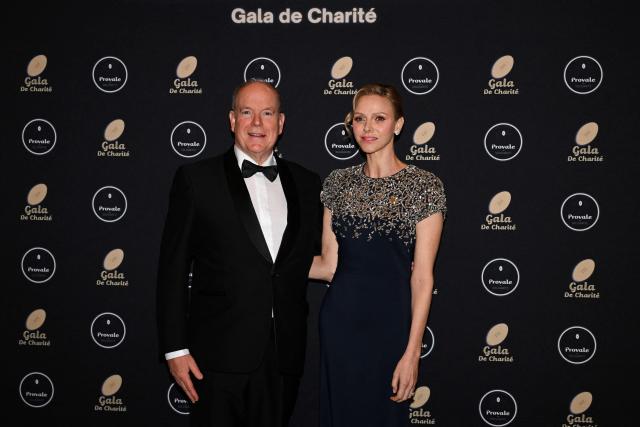 Princess Charlene of Monaco (R) and Prince Albert II of Monaco pose during a photocall as part of the Provale Solidarite charity gala at the Hotel Georges V in Paris on March 13, 2026. (Photo by Bertrand GUAY / AFP) / NO TABLOIDS WEB & PRINT, NO DAILY MAIL, NO DAILY MAIL GROUP, NO VOICI, NO CLOSER