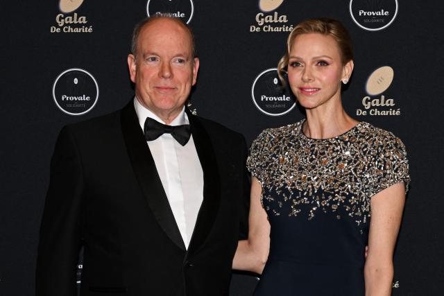 Princess Charlene of Monaco (R) and Prince Albert II of Monaco pose during a photocall as part of the Provale Solidarite charity gala at the Hotel Georges V in Paris on March 13, 2026. (Photo by Bertrand GUAY / AFP) / NO TABLOIDS WEB & PRINT, NO DAILY MAIL, NO DAILY MAIL GROUP, NO VOICI, NO CLOSER