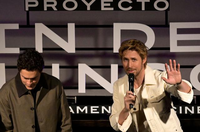 Canadian actor Ryan Gosling (R) speaks next to US film director and screenwriter Phil Lord before a press conference for the film "Project Hail Mary" in Mexico City on March 13, 2026. (Photo by Alfredo ESTRELLA / AFP)