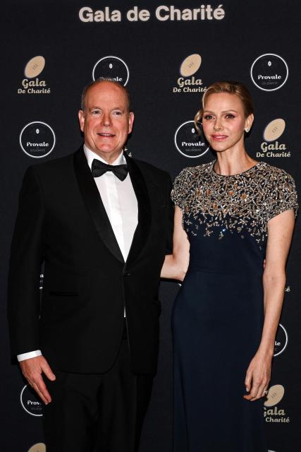 Prince Albert II of Monaco (L) and Princess Charlene of Monaco (R) pose during a photocall as part of the Provale Solidarite charity gala at the Hotel Georges V in Paris on March 13, 2026. (Photo by Bertrand GUAY / AFP) / NO TABLOIDS WEB & PRINT, NO DAILY MAIL, NO DAILY MAIL GROUP, NO VOICI, NO CLOSER