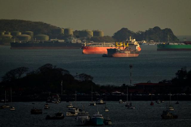 Cargo ships wait to transit the Panama Canal on the Pacific side, in Panama City on March 13, 2026. (Photo by MARTIN BERNETTI / AFP)