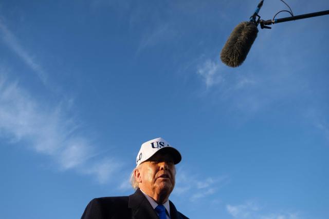 US President Donald Trump speaks to reporters before boarding Air Force One as he departs Joint Base Andrews in Maryland on March 13, 2026. President Trump is heading to Florida to spend the weekend at his Mar-a-Lago resort. (Photo by SAUL LOEB / AFP)