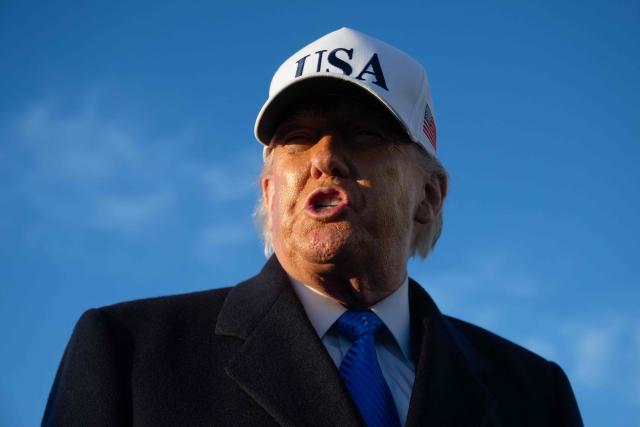 US President Donald Trump speaks to reporters before boarding Air Force One as he departs Joint Base Andrews in Maryland on March 13, 2026. President Trump is heading to Florida to spend the weekend at his Mar-a-Lago resort. (Photo by SAUL LOEB / AFP)