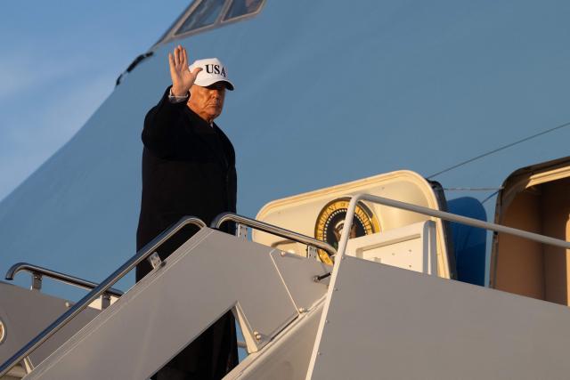 US President Donald Trump waves as he boards Air Force One as he departs Joint Base Andrews in Maryland on March 13, 2026. President Trump is heading to Florida to spend the weekend at his Mar-a-Lago resort. (Photo by SAUL LOEB / AFP)