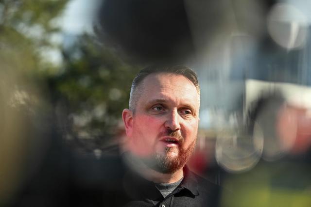 Peter David Balogh, acting spokesperson of the local government, speaks during an interview with AFP near the Samsung SDI battery factory of South Korean industrial giant Samsung near the town of God, about 25 km north of Budapest on March 3, 2026. On the outskirts of the town of God, not far from Budapest, white smoke is rising from a Samsung electric vehicle battery factory accused of having exposed workers to health hazards, while Hungary's government failed to shut it down. The allegations revealed by Hungarian news site Telex last month come at a sensitive time for nationalist Prime Minister Viktor Orban as he faces an unprecedented challenge to his 16 years in power in April 12 elections. (Photo by Attila KISBENEDEK / AFP)
