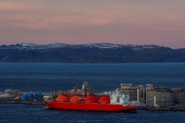 (FILES) In this file photo taken on November 2, 2022, a LNG ship is pictured at the island Melkoya where Norwegian energy giant Equinor has built a facility for receiving and processing natural gas from the Snøhvit field in the Barents Sea. Having become Europe's main gas supplier as a result of the war in Ukraine, Norway is seeking to gain Brussels' favor to drill in the Arctic, pointing to the vulnerability of supplies from the Middle East. (Photo by Fredrik Varfjell / NTB / AFP) / Norway OUT