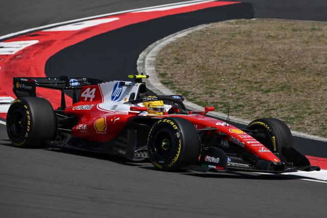 Ferrari's British driver Lewis Hamilton drives during the sprint race ahead of the Formula One Chinese Grand Prix at the Shanghai International Circuit in Shanghai on March 14, 2026. (Photo by JADE GAO / AFP)