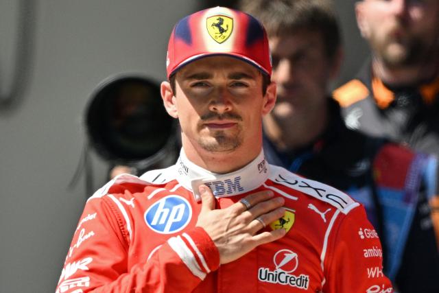 Ferrari's Monegasque driver Charles Leclerc gestures at the end of the sprint race ahead of the Formula One Chinese Grand Prix in the Shanghai International Circuit of Shanghai on March 14, 2026. (Photo by HECTOR RETAMAL / AFP)