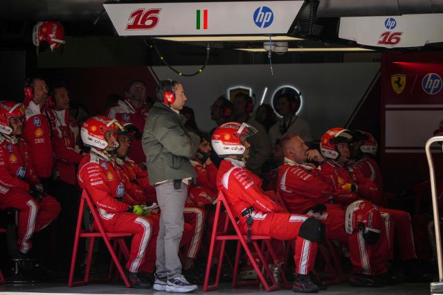 Crew members for Ferrari's Monegasque driver Charles Leclerc watch the sprint race in the pits ahead of the Formula One Chinese Grand Prix at the Shanghai International Circuit in Shanghai on March 14, 2026. (Photo by Andy Wong / POOL / AFP)