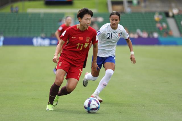 China’s Wu Chengshu (L) and Taiwan’s Chen Yu-chin fight for the ball during the AFC Women's Asian Cup Australia 2026 football match between China and Taiwan in Perth on March 14, 2026. (Photo by Antony DICKSON / AFP)