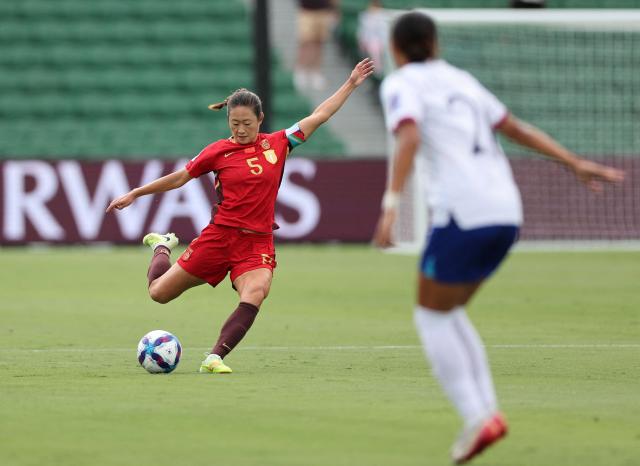 China’s Wu Haiyan kicks the ball against Taiwan during the AFC Women's Asian Cup Australia 2026 football match between China and Taiwan in Perth on March 14, 2026. (Photo by Antony DICKSON / AFP)