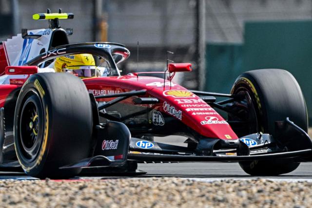 Ferrari's British driver Lewis Hamilton drives during the sprint race ahead of the Formula One Chinese Grand Prix at the Shanghai International Circuit in Shanghai on March 14, 2026. (Photo by Hector RETAMAL / AFP)