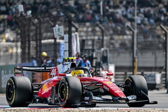 Ferrari's British driver Lewis Hamilton drives during the sprint race ahead of the Formula One Chinese Grand Prix at the Shanghai International Circuit in Shanghai on March 14, 2026. (Photo by Hector RETAMAL / AFP)