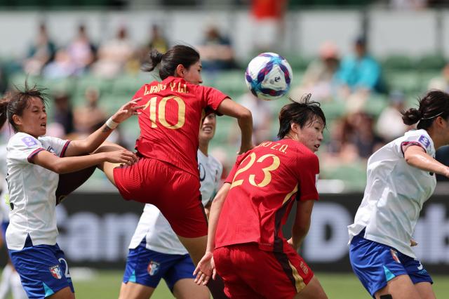 China’s Wang Yanwen (10) and teammate Shao Ziqin (23) look at the ball as it sails past during the AFC Women's Asian Cup Australia 2026 football match between China and Taiwan in Perth on March 14, 2026. (Photo by Antony DICKSON / AFP)