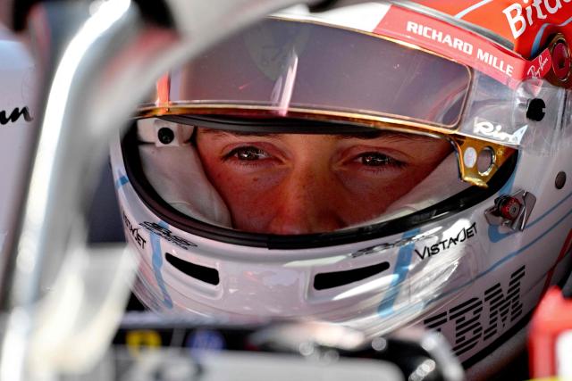 Ferrari's Monegasque driver Charles Leclerc sits in his car before the start of the sprint race ahead of the Formula One Chinese Grand Prix at the Shanghai International Circuit in Shanghai on March 14, 2026. (Photo by Hector RETAMAL / AFP)