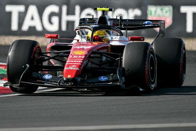 Ferrari's British driver Lewis Hamilton drives during the qualifying session ahead of the Formula One Chinese Grand Prix at the Shanghai International Circuit in Shanghai on March 14, 2026. (Photo by Greg Baker / AFP)