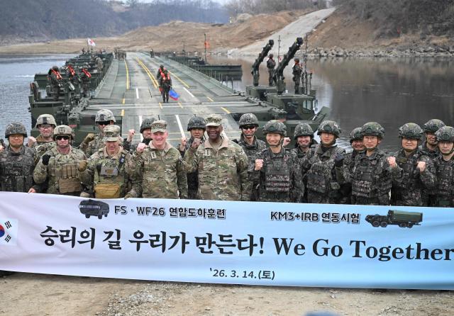 US General Xavier T. Brunson (C), commander of the US Forces Korea, United Nations Command and Combined Forces Command, poses for a photo with South Korea and US military officers as they visit to watch a combined maneuver training with wet gap crossing during the 2026 South Korea-US Freedom Shield military exercise in Yeoncheon on March 14, 2026. (Photo by Jung Yeon-je / AFP)