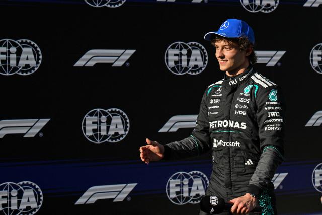 Mercedes' Italian driver Kimi Antonelli celebrates after taking the pole position during the qualifying session ahead of the Formula One Chinese Grand Prix at the Shanghai International Circuit in Shanghai on March 14, 2026. (Photo by Hector RETAMAL / AFP)