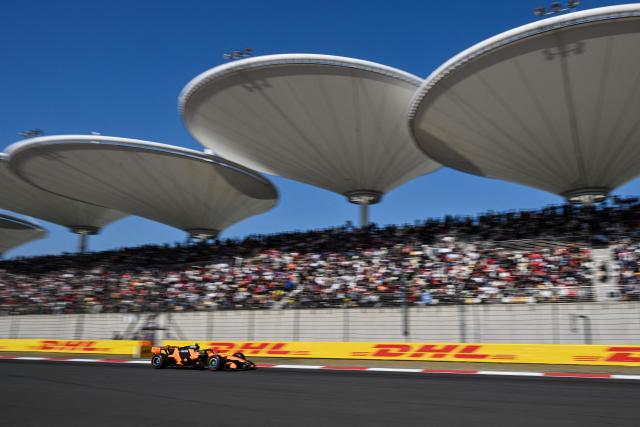 McLaren's British driver Lando Norris drives during the qualifying session ahead of the Formula One Chinese Grand Prix at the Shanghai International Circuit in Shanghai on March 14, 2026. (Photo by Hector RETAMAL / AFP)