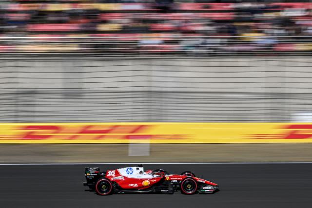 Ferrari's Monegasque driver Charles Leclerc drives during the qualifying session ahead of the Formula One Chinese Grand Prix at the Shanghai International Circuit in Shanghai on March 14, 2026. (Photo by Jade GAO / AFP)