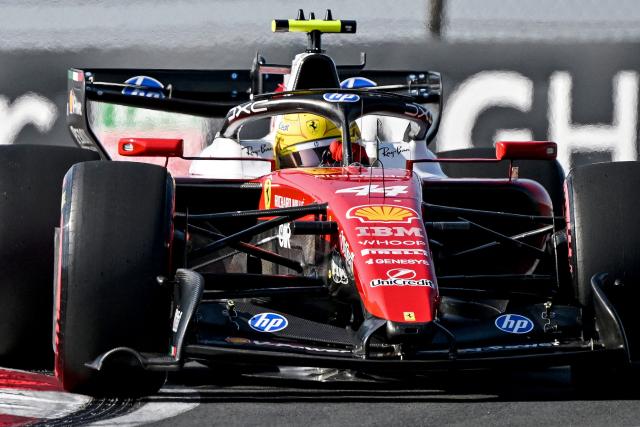 Ferrari's British driver Lewis Hamilton drives during the qualifying session ahead of the Formula One Chinese Grand Prix at the Shanghai International Circuit in Shanghai on March 14, 2026. (Photo by GREG BAKER / AFP)