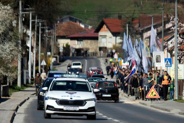 Dozens of Croatian conservative Catholics march in the streets of Croatian city of Karlovac, on March 14, 2026. The prayers, led by the conservative Catholic men's group "Be Manly", have been held across Croatia on the first Saturday of every month since 2022. They have attracted a small but dedicated following in the staunchly Catholic nation of 3.8 million people, where traditional values are widespread. (Photo by DANIEL KASAP / AFP)