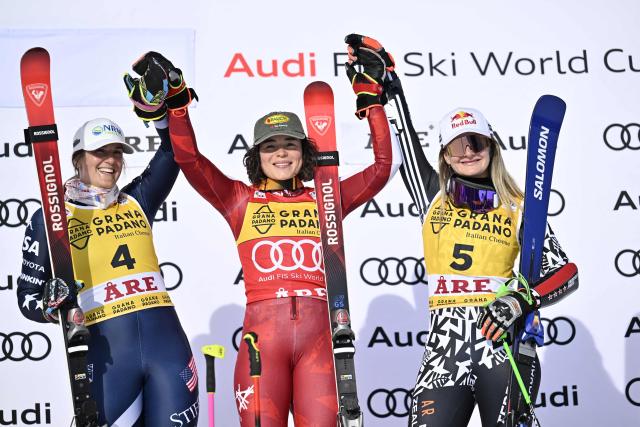 (L-R) Second placed US' Paula Moltzan, first placed Austria's Julia Scheib and thid placed New Zealand's Alice Robinson celebrate on the podium after winning the women's giant slalom race during the FIS Ski World Cup event in Are, Sweden, on March 14, 2026. (Photo by Pontus LUNDAHL / TT News Agency / AFP) / Sweden OUT