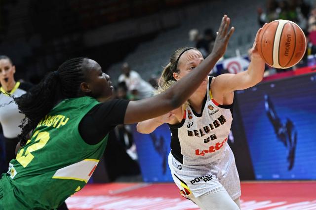 Mali's Kamite Elisabeth Dabou (C) and Belgium's Julie Allemand (R) vie for the ball during the FIBA Women's Basketball World Cup 2026 qualifying tournament game between Belgium and Mali in Wuhan, in central China's Hubei province on March 14, 2026. (Photo by CN-STR / AFP) / China OUT