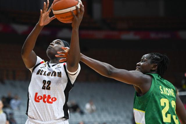 Mali's Sika Kone (R) blocks as Belgium's Bethy Mununga (L) shoots during the FIBA Women's Basketball World Cup 2026 qualifying tournament game between Belgium and Mali in Wuhan, in central China's Hubei province on March 14, 2026. (Photo by CN-STR / AFP) / China OUT