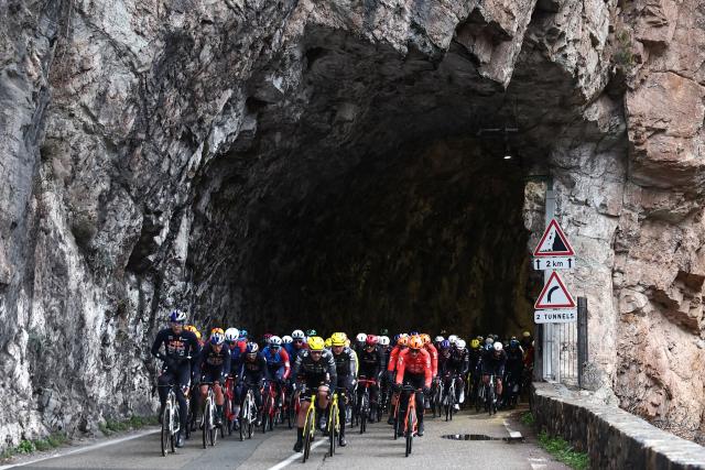 The pack rides during the 7th stage of the Paris-Nice cycling race, 47 km between Le Broc and Isola-Village, on March 14, 2026. Due to deteriorating weather conditions, the route of stage 7 has been changed to a 47 km race from Le Broc to Isola. (Photo by Anne-Christine POUJOULAT / AFP)
