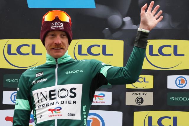INEOS Grenadiers' French rider Dorian Godon celebrates his green jersey of best sprinter on the podium after the 7th stage of the Paris-Nice cycling race, 47 km between Le Broc and Isola-Village, on March 14, 2026. Due to deteriorating weather conditions, the route of stage 7 has been changed to a 47 km race from Le Broc to Isola. (Photo by Anne-Christine POUJOULAT / AFP)