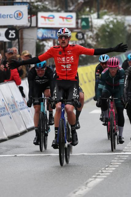 INEOS Grenadiers' French rider Dorian Godon celebrates as he crosses the finish line to win the 7th stage of the Paris-Nice cycling race, 47 km between Le Broc and Isola-Village, on March 14, 2026. Due to deteriorating weather conditions, the route of stage 7 has been changed to a 47 km race from Le Broc to Isola. (Photo by Anne-Christine POUJOULAT / AFP)