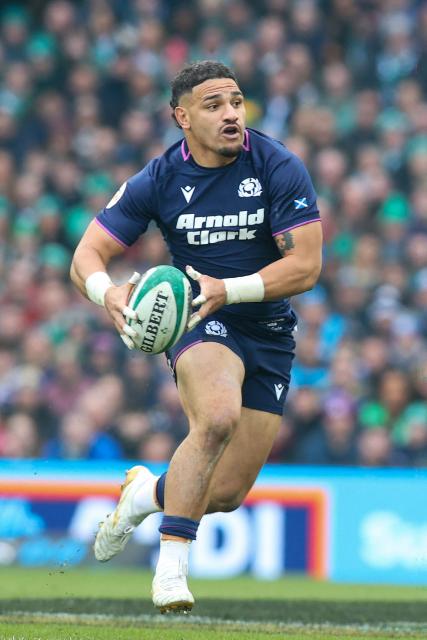 Scotland's centre Sione Tuipulotu runs with the ball during the Six Nations international rugby union match between Ireland and Scotland at the Aviva Stadium in Dublin, on March 14, 2026. (Photo by Paul Faith / AFP)