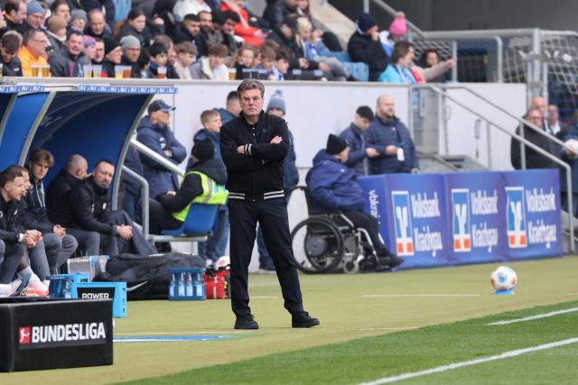 Wolfsburg's head coach Dieter Hecking reacts during the German first division Bundesliga football match between TSG 1899 Hoffenheim and VfL Wolfsburg in Sinsheim, southwestern Germany on March 14, 2026. (Photo by Daniel ROLAND / AFP) / DFL REGULATIONS PROHIBIT ANY USE OF PHOTOGRAPHS AS IMAGE SEQUENCES AND/OR QUASI-VIDEO