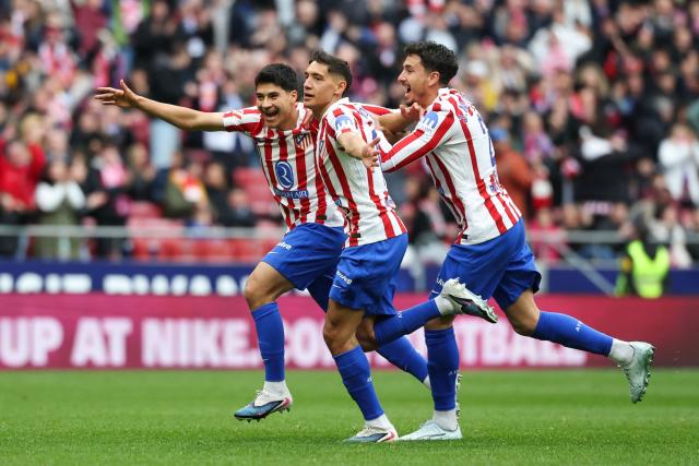 Atletico Madrid's Argentine defender #16 Nahuel Molina Lucero (C) celebrates scoring his team's first goal during the Spanish league football match between Club Atletico de Madrid and Getafe CF at Metropolitano Stadium in Madrid on March 14, 2026. (Photo by Pierre-Philippe MARCOU / AFP)