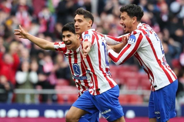 Atletico Madrid's Argentine defender #16 Nahuel Molina Lucero (C) celebrates scoring his team's first goal during the Spanish league football match between Club Atletico de Madrid and Getafe CF at Metropolitano Stadium in Madrid on March 14, 2026. (Photo by Pierre-Philippe MARCOU / AFP)