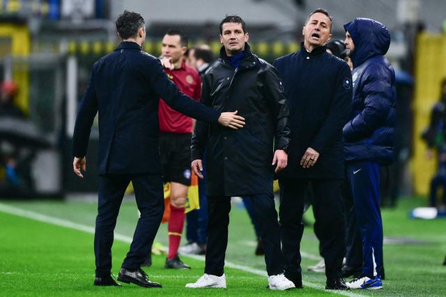 Inter Milan’s Romanian coach Cristian Chivu (C) reacts after he received a red card during the Italian Serie A football match between Inter Milan and Atalanta at the San Siro stadium in Milan, northern Italy, on March 14, 2026. (Photo by MARCO BERTORELLO / AFP)