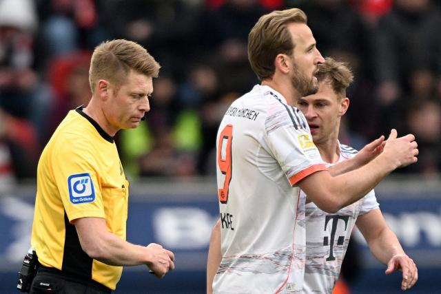 Bayern Munich's English forward #09 Harry Kane reacts after his goal was disallowed by German referee Christian Dingert during the German first division Bundesliga football match between Bayer 04 Leverkusen and FC Bayern Munich in Leverkusen, western Germany on March 14, 2026. (Photo by INA FASSBENDER / AFP) / DFL REGULATIONS PROHIBIT ANY USE OF PHOTOGRAPHS AS IMAGE SEQUENCES AND/OR QUASI-VIDEO