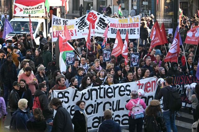 Protesters chant slogans and hold banners as they demonstrate during a rally against racism, fascism and state violence, in Paris on March 14, 2026. Some 85 rallies have been announced throughout France for March 14, on the eve of a highly uncertain local election. The vote serves as a test one year ahead of the 2027 presidential election, particularly for the far right, which hopes to build on its momentum. (Photo by Martin LELIEVRE / AFP)