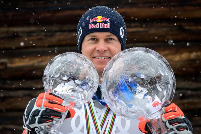 (FILES) France's Alexis Pinturault poses for pictures with the Men's Overall Cristal Globe of the FIS Alpine Ski World Cup and the Overall Cristal Globe of the FIS Alpine Ski World Cup for the Men's Giant Slalom during the FIS Alpine ski World Cup in Lenzerheide, on March 21, 2021. From the Face de Bellevarde in Val d'Isère to the Streif in Kitzbühel, Alexis Pinturault, who announced on March 13, 2026 that he was retiring at the age of almost 35, demonstrated exceptional versatility, as evidenced by several memorable races on legendary slopes. (Photo by Fabrice COFFRINI / AFP)