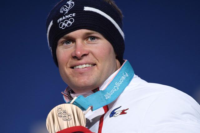 (FILES) France's bronze medallist Alexis Pinturault poses on the podium during the medal ceremony for the alpine skiing men's giant slalom at the Pyeongchang Medals Plaza during the Pyeongchang 2018 Winter Olympic Games in Pyeongchang on February 18, 2018. From the Face de Bellevarde in Val d'Isère to the Streif in Kitzbühel, Alexis Pinturault, who announced on March 13, 2026 that he was retiring at the age of almost 35, demonstrated exceptional versatility, as evidenced by several memorable races on legendary slopes. (Photo by JAVIER SORIANO / AFP)