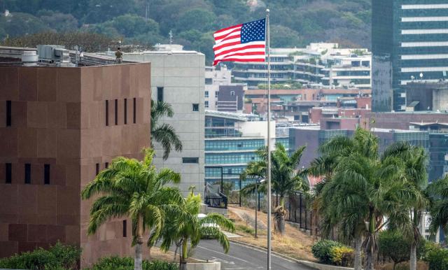 The US flag flutters at the US embassy in Caracas on March 14, 2026, ten days after the restoration of diplomatic relations following the capture of ousted leader Nicolas Maduro in a US military raid. (Photo by Maryorin Mendez / AFP)