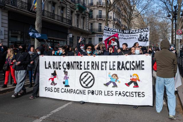Protesters carry a banner which reads "Street protests against Rassemblement National (RN) and racism" during a demonstration against racism, facism and state violence in Marseille, southern France, on March 14, 2026. Some 85 rallies have been announced throughout France for March 14, on the eve of a highly uncertain local election. The vote serves as a test one year ahead of the 2027 presidential election, particularly for the far right, which hopes to build on its momentum. (Photo by Elodie CLEMENT / AFP)